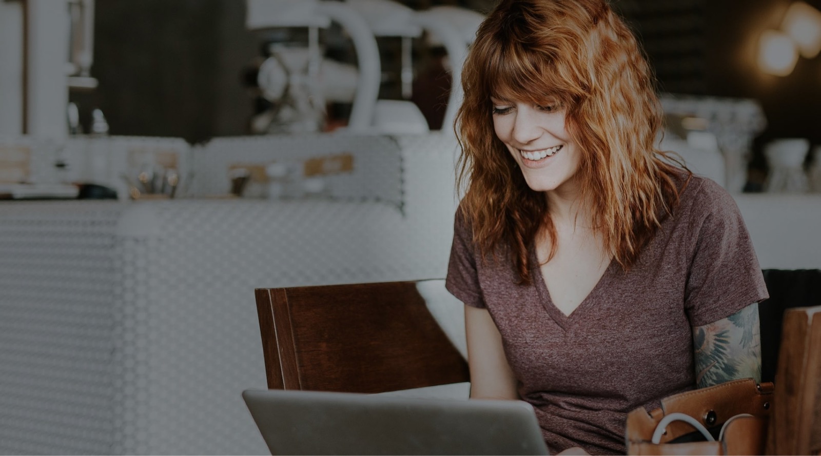Person working at a laptop while reviewing supplier options
